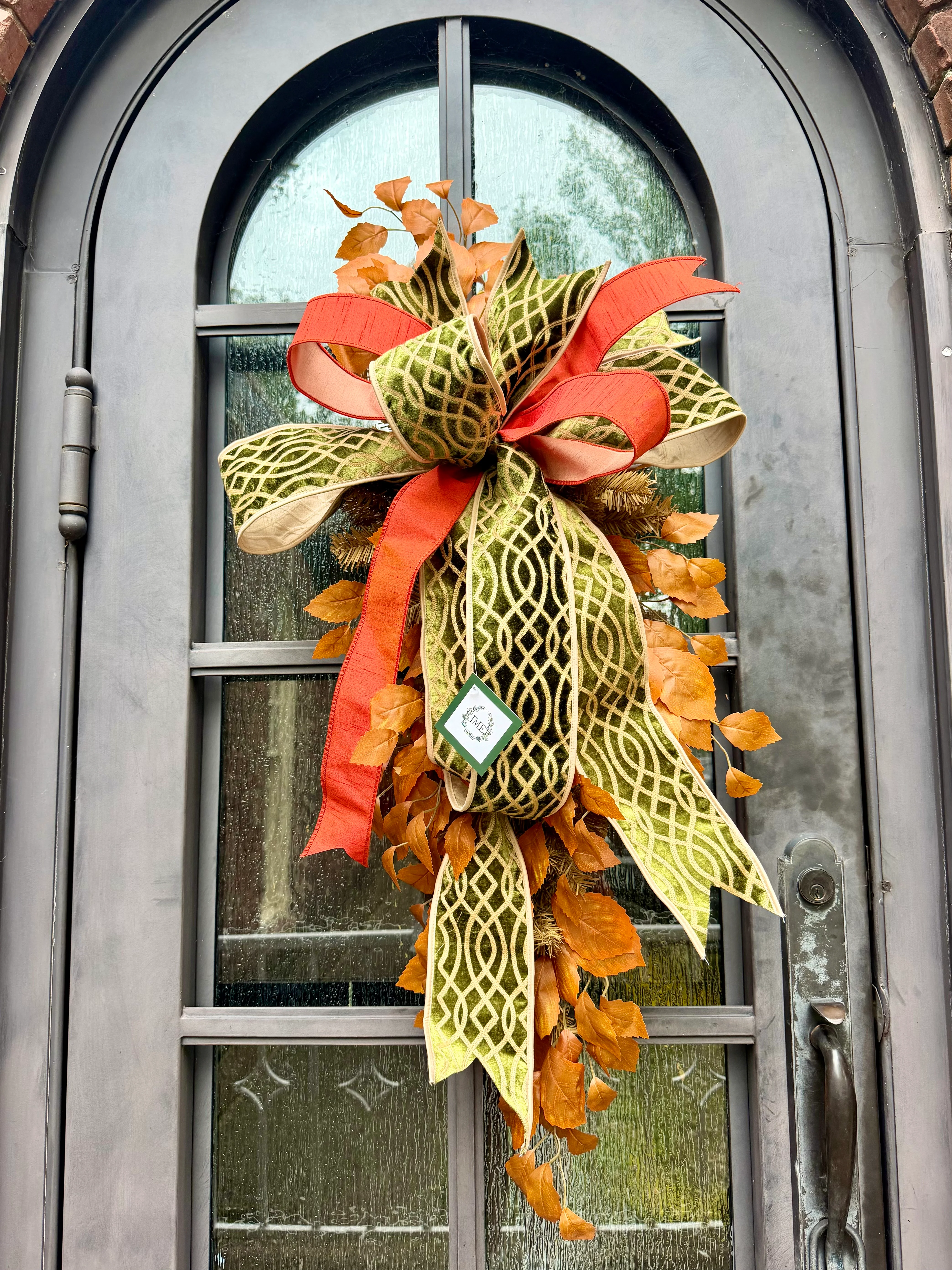 Handmade JME fall door swag made with faux fall leaves and paired with a beautiful green embroidered JME bow. About 3 feet long by 21 inches wide. *Some fluffing may be required upon receiving. ￼ - Image 2